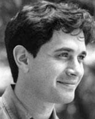 Michael Mitzenmacher. Black and White Headshot of Michael, who is looking right. He has short dark hair and is smiling.