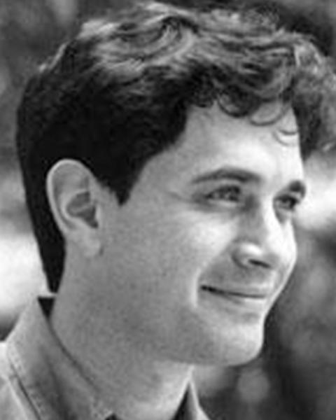 Michael Mitzenmacher. Black and White Headshot of Michael, who is looking right. He has short dark hair and is smiling.